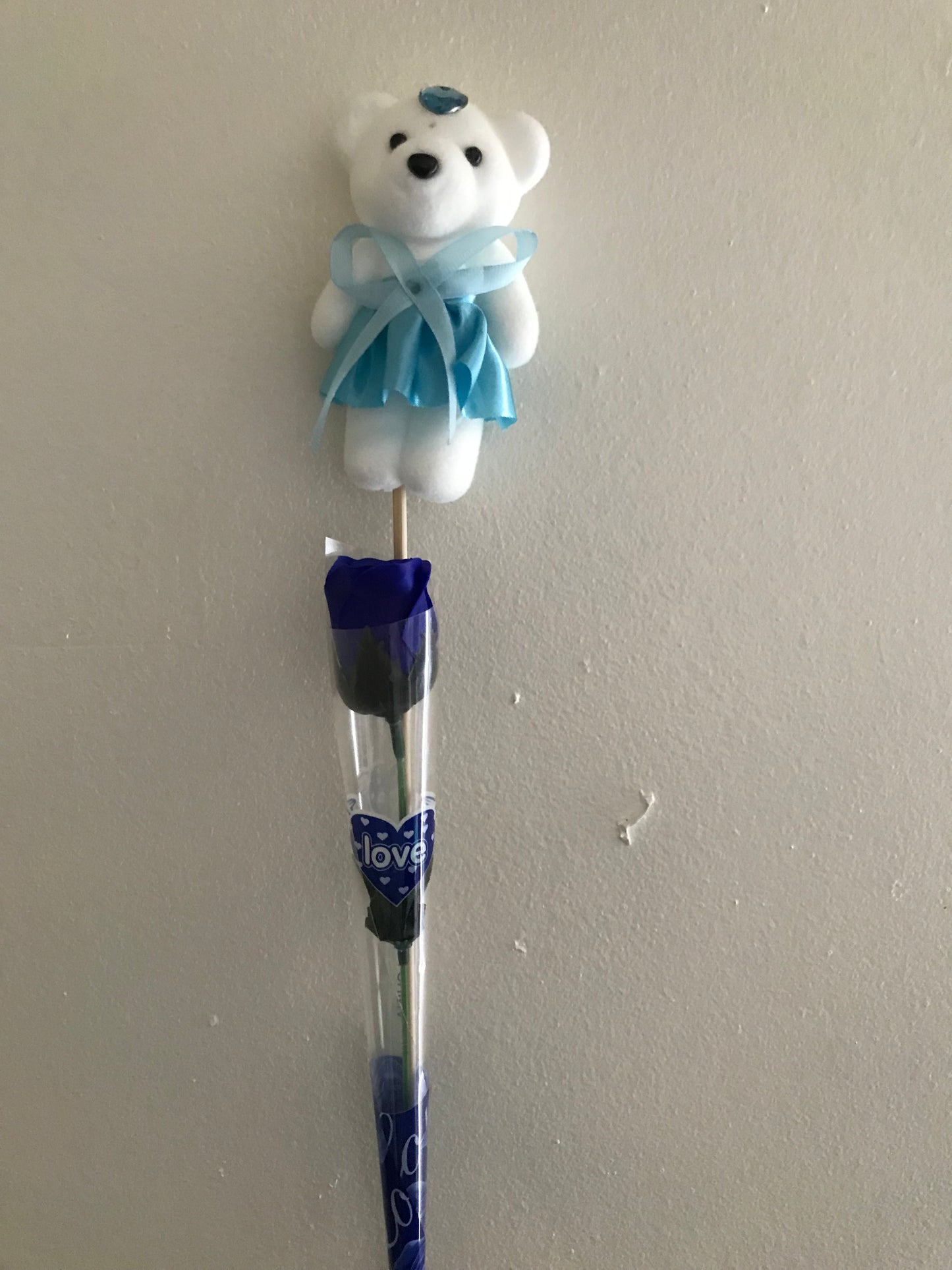 Artificial rose and bear