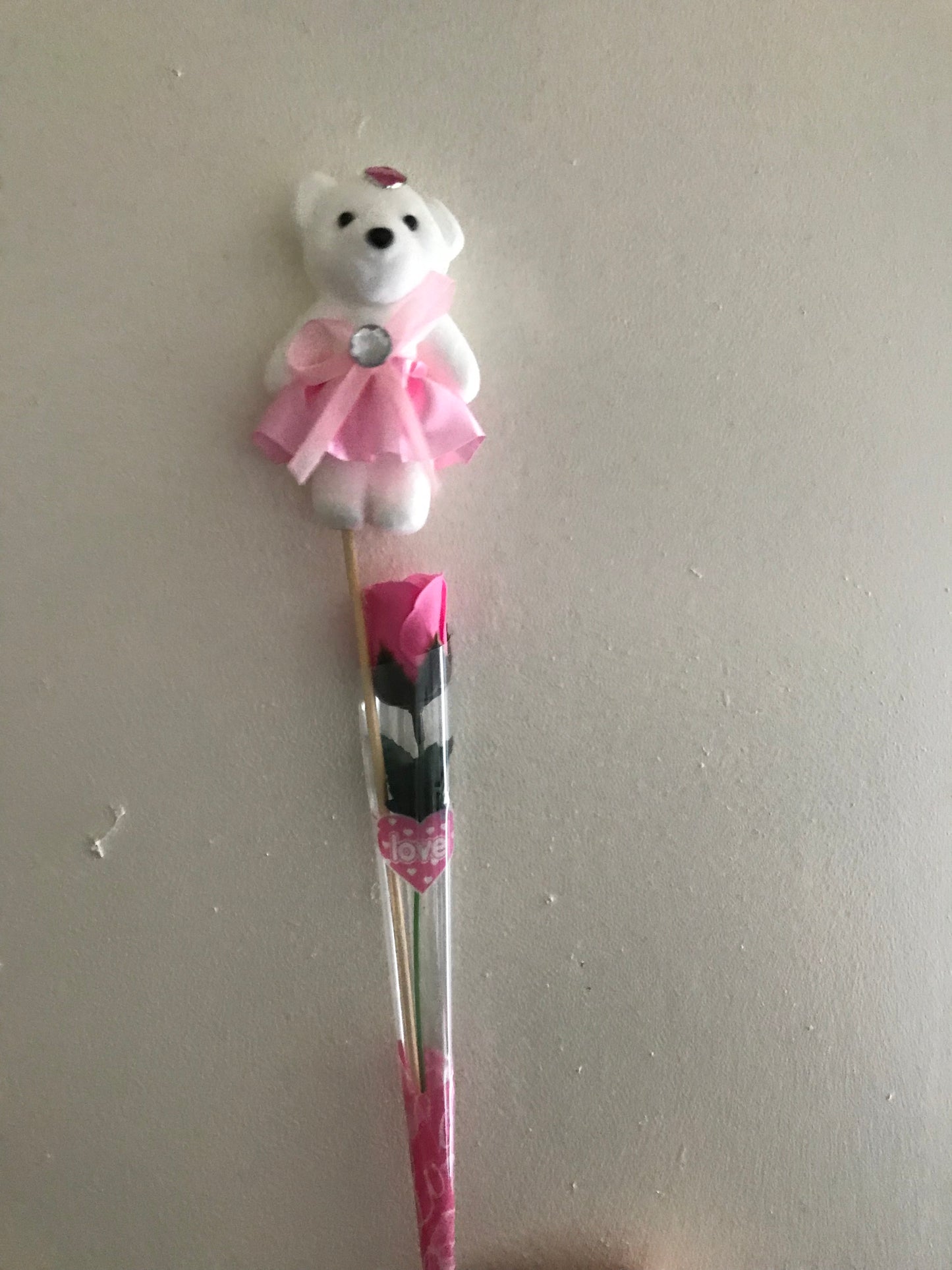 Artificial rose and bear