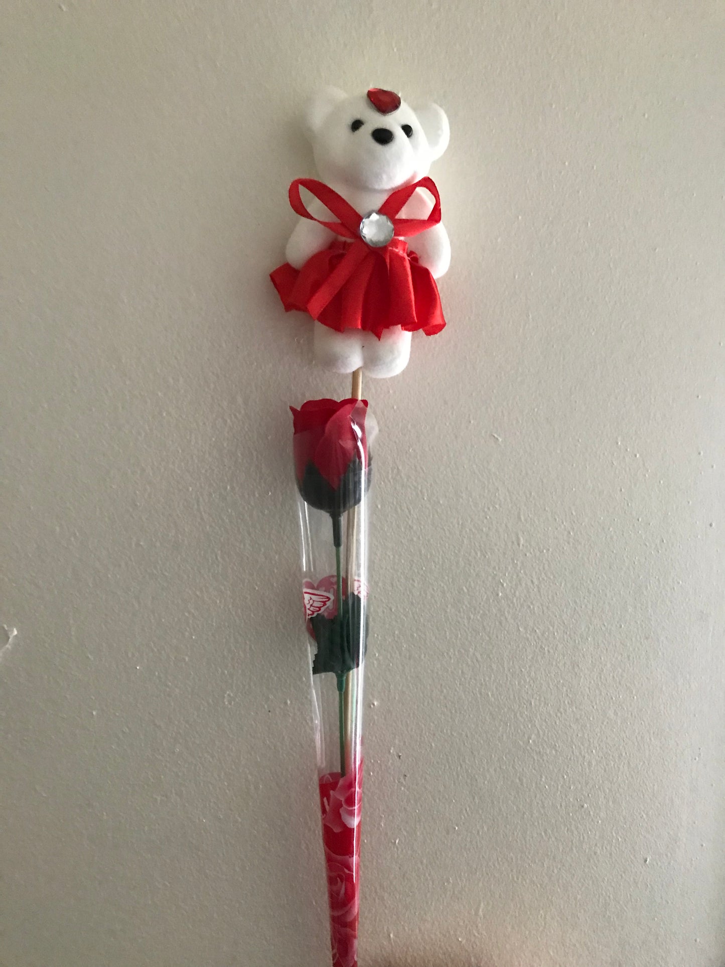 Artificial rose and bear