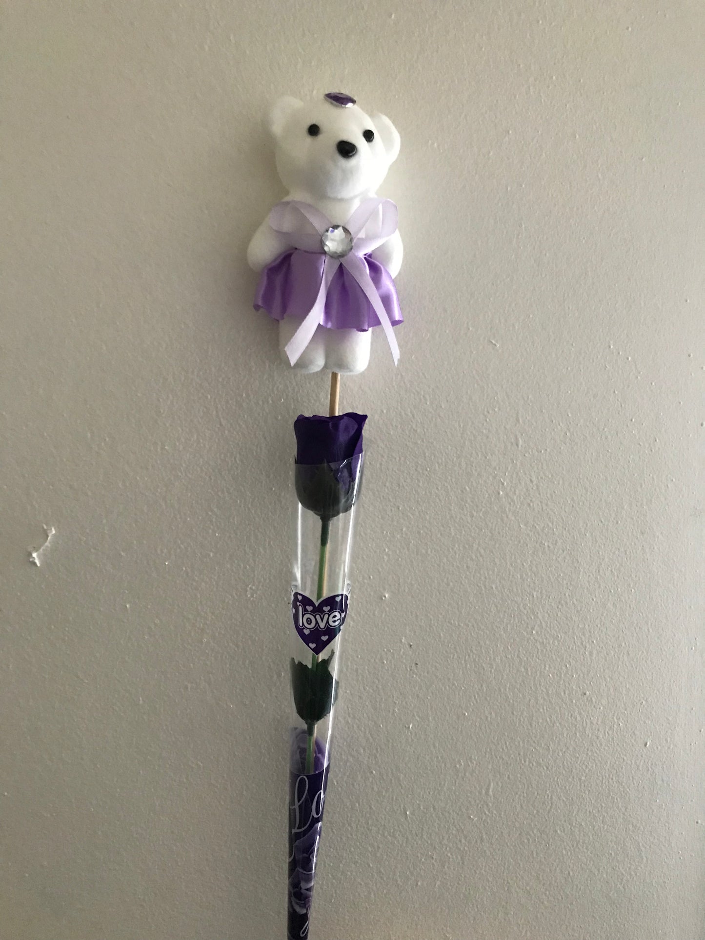 Artificial rose and bear