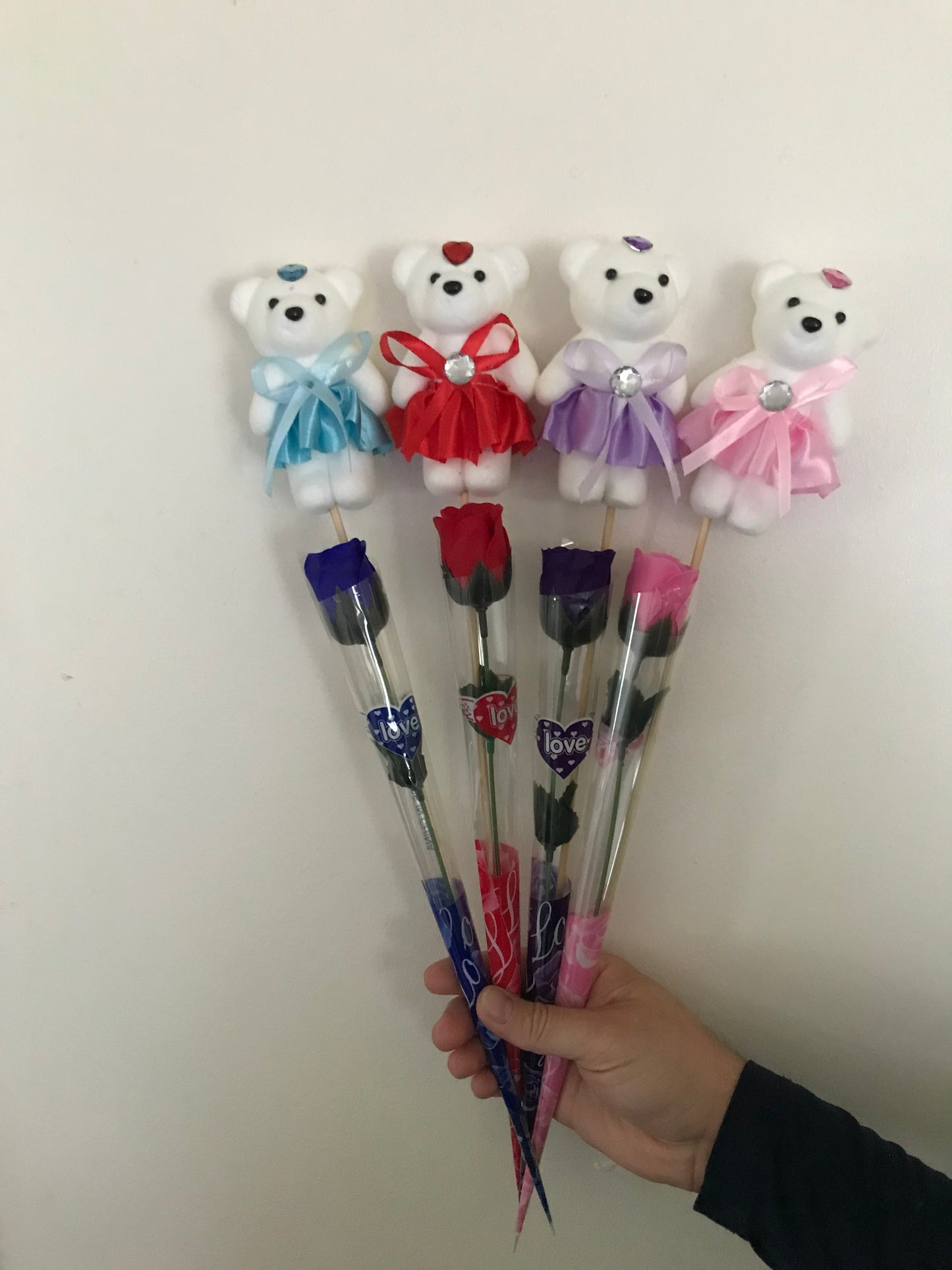 Artificial rose and bear